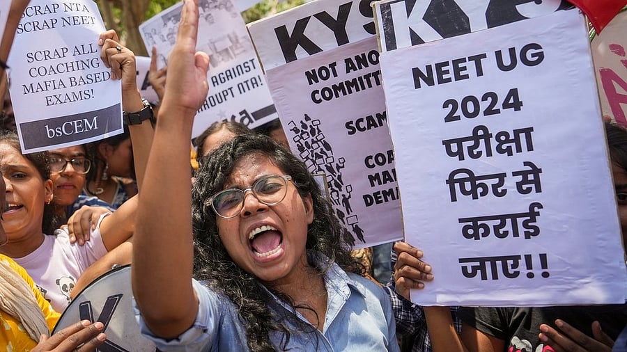 <div class="paragraphs"><p>Members of various student organisations stage a protest against the alleged irregularities in the NEET-UG 2024 entrance exam result in New Delhi on Monday.</p></div>