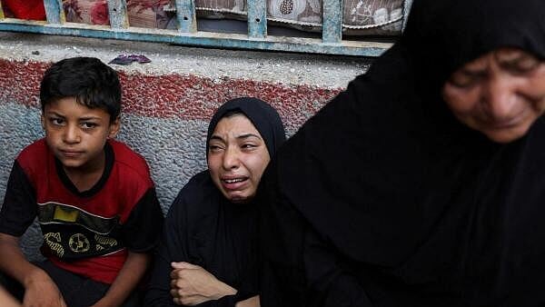<div class="paragraphs"><p>A woman reacts at the site of an Israeli strike on a UNRWA school sheltering displaced people, amid the Israel-Hamas conflict, in Nuseirat refugee camp in the central Gaza Strip</p></div>