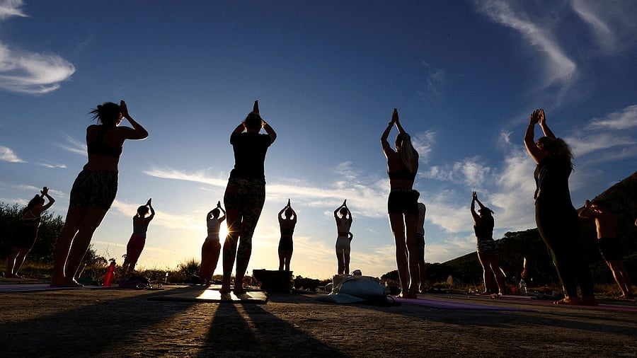 <div class="paragraphs"><p>People perform yoga near Table Mountain in Cape Town, South Africa, January 18, 2024. </p></div>