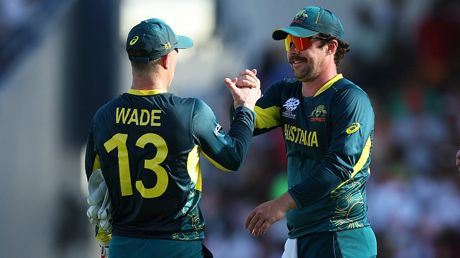 <div class="paragraphs"><p> Australia's Matthew Wade and Travis Head celebrate during a match in the ongoing T20 World Cup.</p></div>