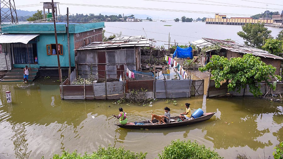 <div class="paragraphs"><p>File Photo: Locals move their belongings on a boat in Assam.</p></div>
