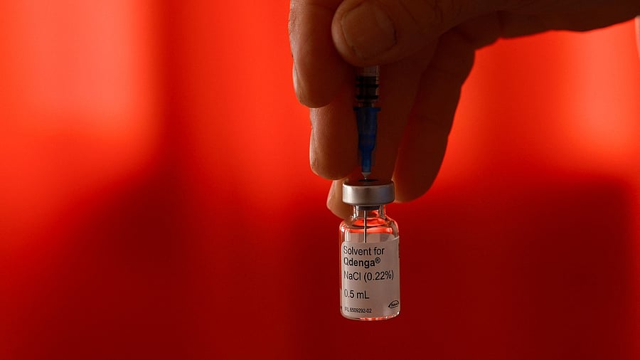 <div class="paragraphs"><p>A health worker holds a vial of dengue vaccine Qdenga.</p></div>