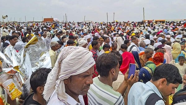 <div class="paragraphs"><p>Devotees at the religious gathering where a stampede broke out, in Hathras district, Tuesday, July 2, 2024.</p></div>
