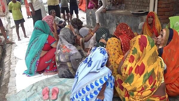 <div class="paragraphs"><p>Relatives mourn near the body of a victim a day after a stampede that occured during a 'satsang' (religious congregation), in Sikandra Rao area of Hathras district, Wednesday, July 3, 2024. At least 121 people were killed in the incident and several injured, according to officials. </p></div>