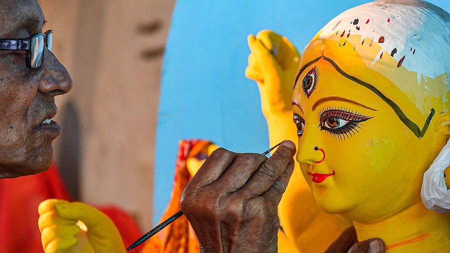 <div class="paragraphs"><p>An artist gives finishing touches to an idol of Goddess Durga ahead of the Durga Puja festival, at Kumartuli in Kolkata.</p></div>
