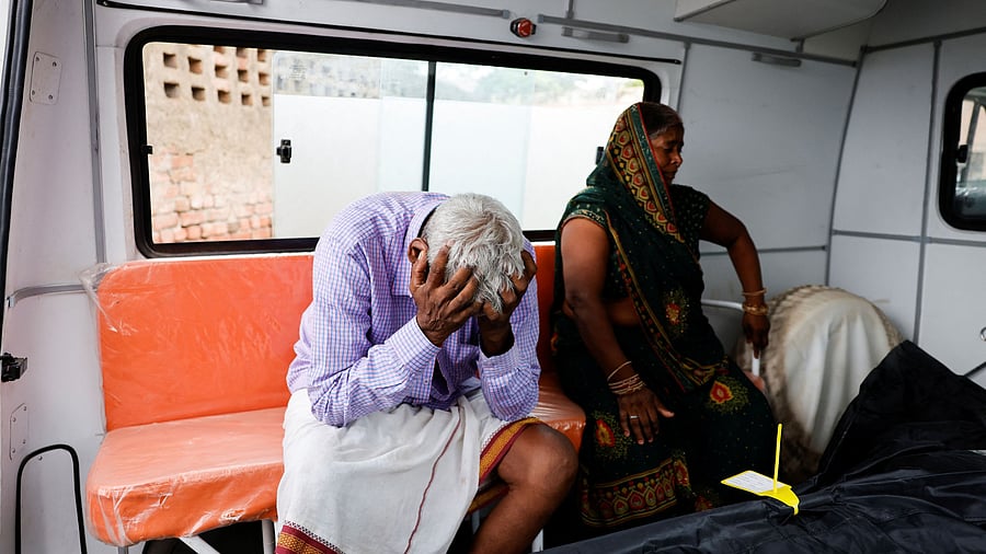 <div class="paragraphs"><p>Kin of a victim mourn next to her body, in the aftermath of the Hathras stampede.</p></div>