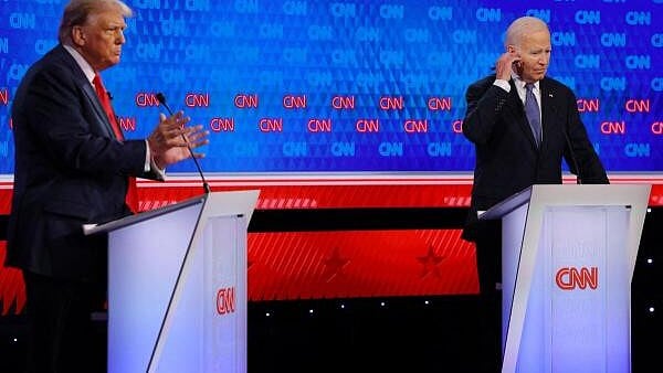 <div class="paragraphs"><p>Democrat candidate, US President Joe Biden, and Republican candidate, former US President Donald Trump, attend a debate ahead of the US presidential election, in Atlanta, Georgia, US.</p></div>