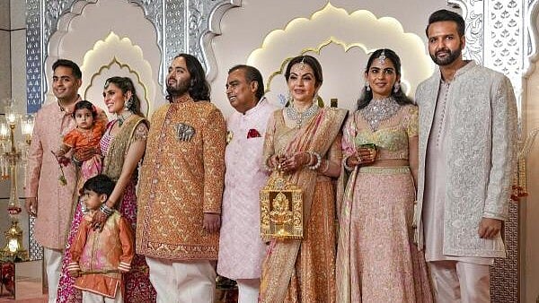 <div class="paragraphs"><p>Reliance Industries Chairman Mukesh Ambani with wife Nita Ambani, sons Akash and Anant Ambani, daughter-in-law Shloka Mehta Ambani, daughter Isha Ambani and son-in-law Anand Piramal, poses for pictures upon their arrival for Anant and Radhika Merchant's wedding, at Jio World Convention Centre, in Mumbai, Friday. </p></div>