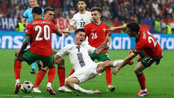 <div class="paragraphs"><p>Slovenia's Benjamin Verbic in action with Portugal's Joao Cancelo, Joao Palhinha, Francisco Conceicao and Diogo Jota</p></div>