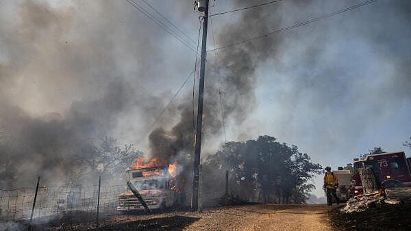 <div class="paragraphs"><p>A view of vehicle on fire as firefighters battle the Grubbs fire near Palermo, California.</p></div>