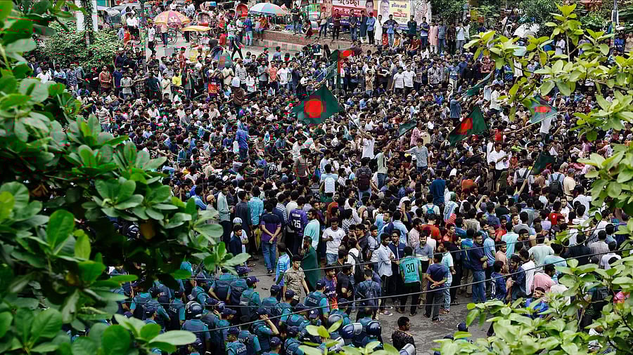 <div class="paragraphs"><p>Students and job seekers block a road as they protest to ban quotas for government job at Shahbagh Square in Dhaka, Bangladesh, July 3, 2024. </p></div>