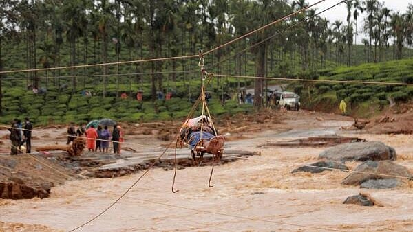 <div class="paragraphs"><p>An injured being shifted using ropeway as rescue operation is underway after landslides triggered by heavy monsoon rains, at Chooralmala in Wayanad dristrict,</p></div>