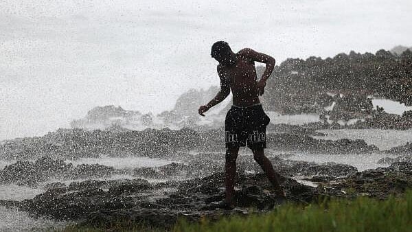 <div class="paragraphs"><p>A person walks along the shore as Hurricane Beryl moves south of the island, in Santo Domingo, Dominican Republic, July 2, 2024.</p></div>