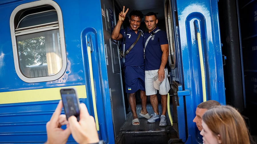 <div class="paragraphs"><p>A gold medallist of 2020 Tokyo Olympics and a member of the Ukrainian Olympic wrestling team Zhan Beleniuk and his teammate Parviz Nasibov say goodbye their friends and families as they board a train to the Paris 2024 Olympics via Poland, amid Russia's attack on Ukraine, in Kyiv, Ukraine July 23, 2024. </p></div>
