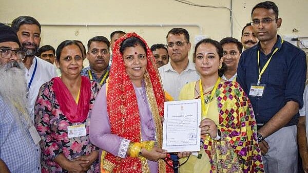 <div class="paragraphs"><p>Congress candidate Kamlesh Thakur receives the 'certificate of election' after her victory from Dehra seat in Himachal Pradesh by-elections in Kangra district on July 13, 2024. </p></div>