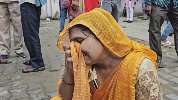 <div class="paragraphs"><p>A relative outside a Trauma Centre where victims of the Hathras' stampede are admitted</p></div>