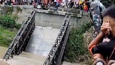 <div class="paragraphs"><p>Screengrab of a video showing a bridge that collapsed at Mutum Phibou of Imphal in Manipur.</p></div>
