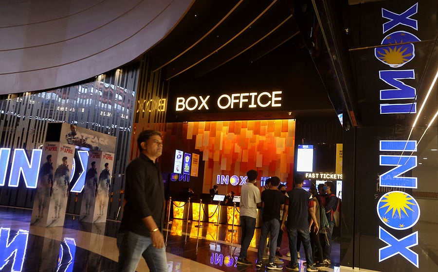 <div class="paragraphs"><p>People visit an PVR INOX movie theatre in Mumbai, India</p></div>