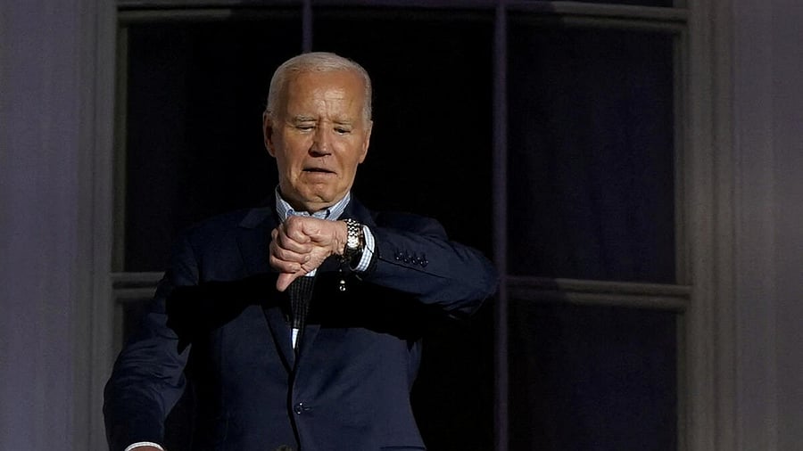 <div class="paragraphs"><p>US President Joe Biden looks at his watch as he stands on the balcony during an Independence Day celebration on the South Lawn of the White House in Washington, US.</p></div>