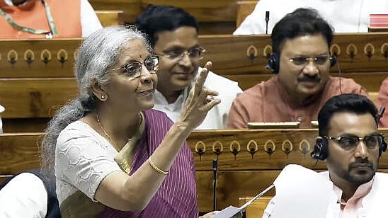 <div class="paragraphs"><p>Union Finance Minister Nirmala Sitharaman speaks in the Lok Sabha during the Monsoon session of Parliament, in New Delhi, Tuesday. </p></div>