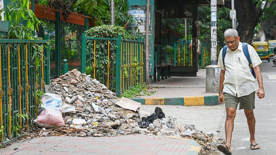 <div class="paragraphs"><p>A footpath at Ranadheera Kanteerava Park, RV Road, blocked by construction debris. This forces pedestrians to jump off the sidewalk, which can prove dangerous. </p></div>