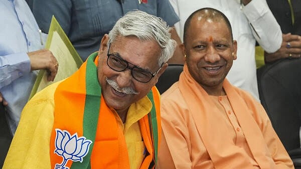 <div class="paragraphs"><p>BJP's Bahoran Lal Maurya with Uttar Pradesh CM Yogi Adityanath.&nbsp;</p></div>