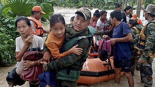 <div class="paragraphs"><p>An Assam Rifles personnel carries a girl during a rescue operation in a flood-affected area, at Bijoypur village in Diyun circle in Changlang district, Arunachal Pradesh, Tuesday. </p></div>