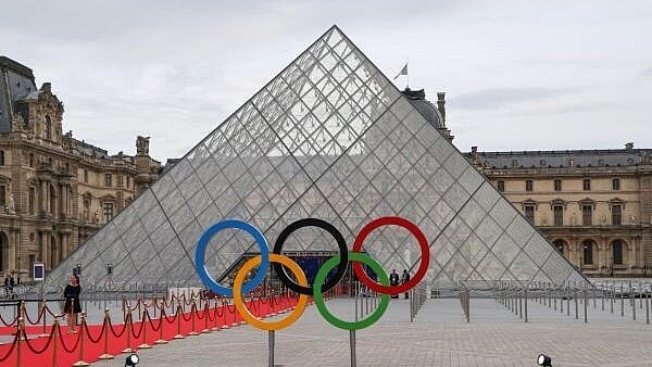 <div class="paragraphs"><p>A view shows Olympic Rings set by the Pyramide du Louvre.</p></div>