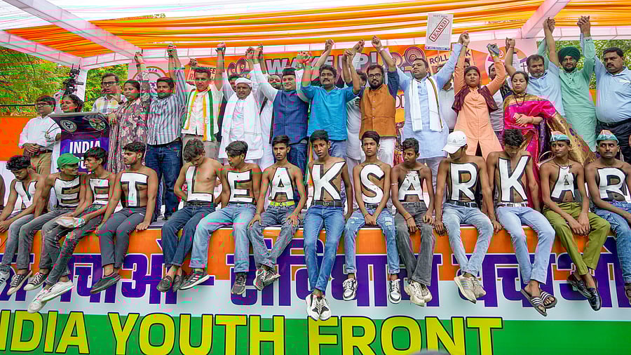 <div class="paragraphs"><p>Members of India Youth Front, an umbrella group representing INDIA bloc parties' youth wings, stage a protest over the alleged irregularities in NEET 2024 results, at Jantar Mantar, in New Delhi, Monday</p></div>