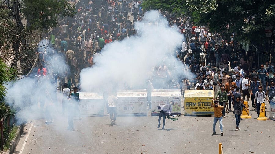 <div class="paragraphs"><p>Police fire teargas during a clash between anti-quota supporters, police and Awami League supporters at the Rampura area in Dhaka. </p></div>