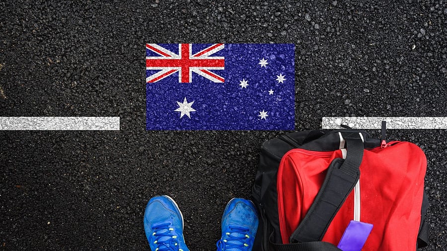 <div class="paragraphs"><p>Representative image showing a person standing over an Australia flag.</p></div>