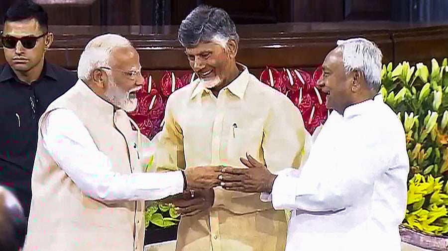 <div class="paragraphs"><p>PM Narendra Modi withN Chandrababu Naidu and Bihar CM Nitish Kumar.</p></div>