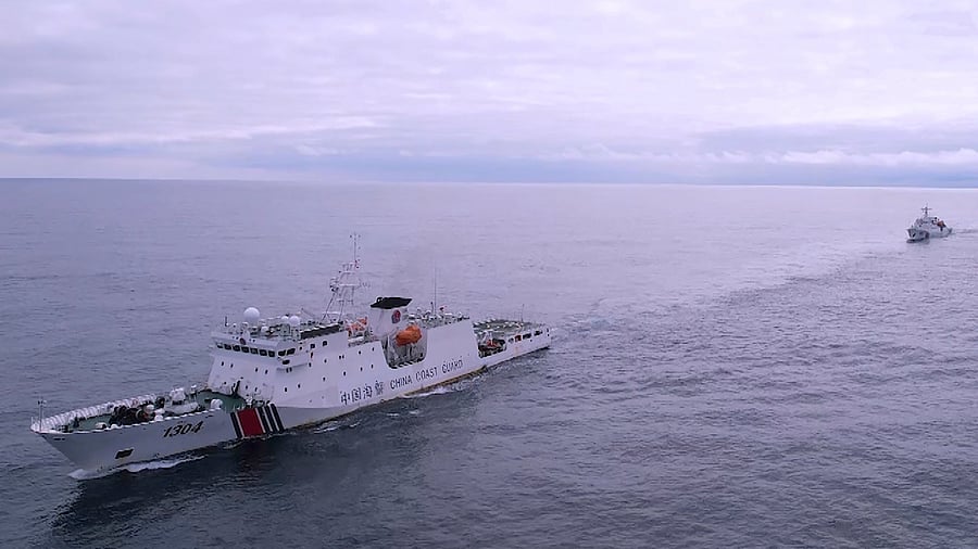 <div class="paragraphs"><p> China Coast Guard ships patrol the high seas of the North Pacific Ocean.</p></div>