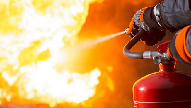 <div class="paragraphs"><p>Representative image showing a person dousing a fire with a fire extinguisher. </p></div>
