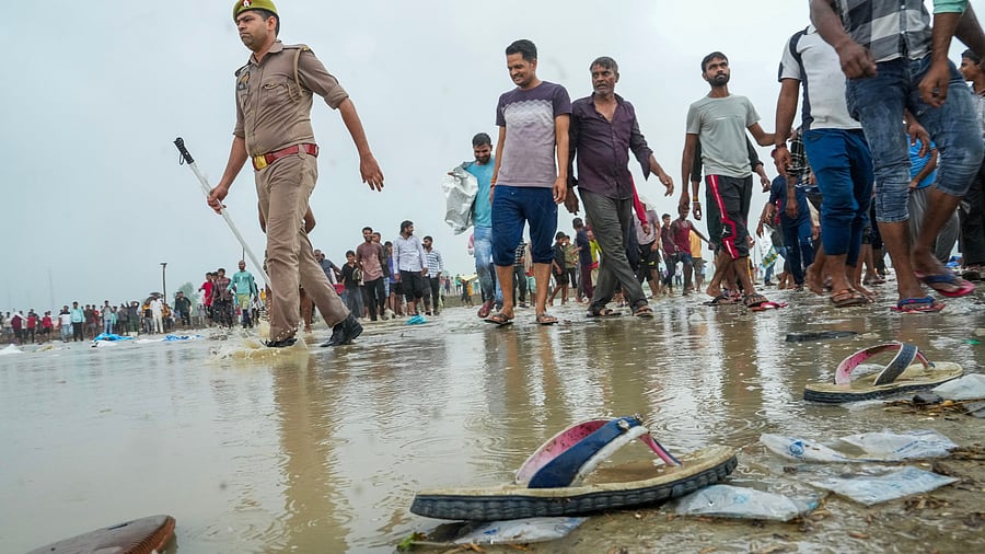 <div class="paragraphs"><p>Police and people at the scene a day after the massive stampede that took place during a 'satsang' (religious congregation), in Sikandara Rao area in Hathras district, Wednesday, July 3, 2024.   </p></div>