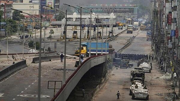 <div class="paragraphs"><p>Smoke rises as security forces engage in clashes, during a curfew imposed in response to student-led protests against government job quotas, in Dhaka, Bangladesh. </p></div>