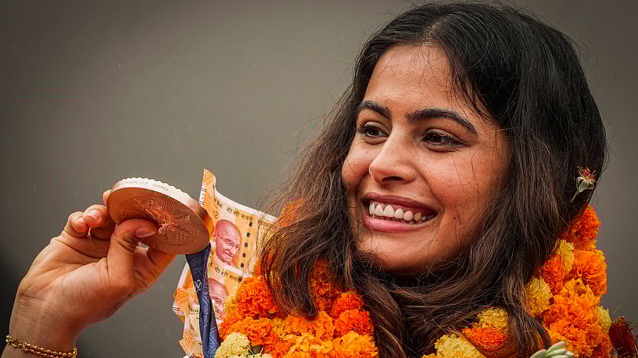 <div class="paragraphs"><p>Manu Bhaker being welcomed upon her arrival at the airport in New Delhi, Wednesday, August 7, 2024. Bhaker, India's first to win two Olympic medals in a single edition, arrived Delhi after a successful campaign at the Paris Games 2024. </p></div>