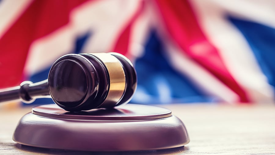<div class="paragraphs"><p>Gavel with UK flag in the background representing a court verdict. </p></div>