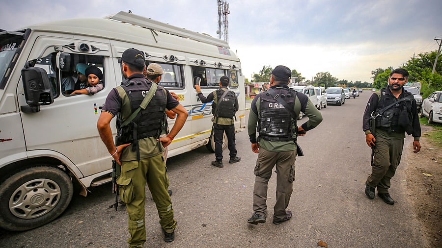 <div class="paragraphs"><p>Jammu: Jammu & Kashmir Police's Crisis Response Team (CRT) personnel check a vehicle during a search operation.</p></div>