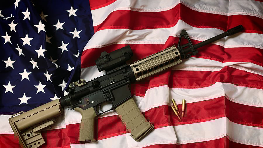 <div class="paragraphs"><p>AR-15 placed on the US flag </p></div>