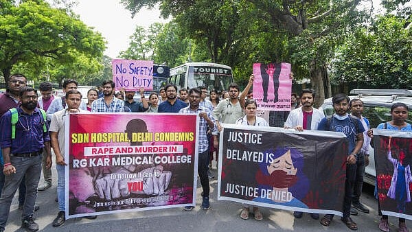 <div class="paragraphs"><p>Doctors protest against the alleged rape and murder of a trainee doctor at Kolkata’s RG Kar Medical College and Hospital.</p></div>