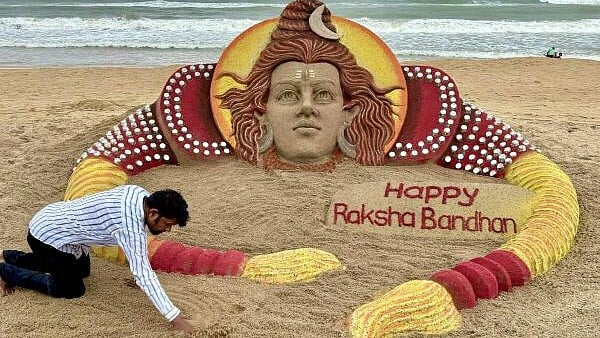 <div class="paragraphs"><p>Sand artist Sudarsan Pattnaik creates a sculpture on the eve of the ‘Raksha Bandhan’ festival, in Puri.</p></div>