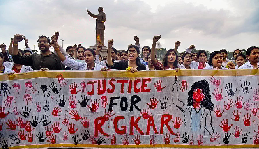 <div class="paragraphs"><p>Doctors stage a protest demanding justice for a woman doctor who was raped and murdered at Kolkata's R G Kar Medical College and Hospital, near Ambedkar statue in Hyderabad, Tuesday, Aug. 20, 2024. </p></div>