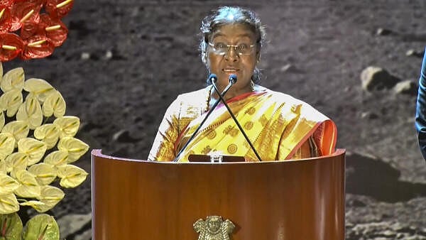 <div class="paragraphs"><p>President Droupadi Murmu with Minister of State for Space Jitendra Singh and ISRO chief S Somanath during the first National Space Day function, in New Delhi. </p></div>