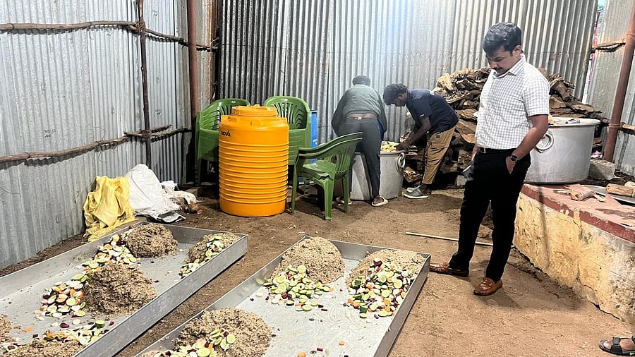 <div class="paragraphs"><p>Deputy conservator of forests I B Prabhu Gowda monitors the preparation of special nutritious food for Dasara elephants.  </p></div>