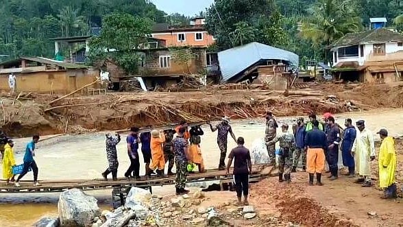 <div class="paragraphs"><p>Indian Navy personnel carry out rescue operation at one of the landslide-hit areas, in Wayanad district, Saturday. </p></div>