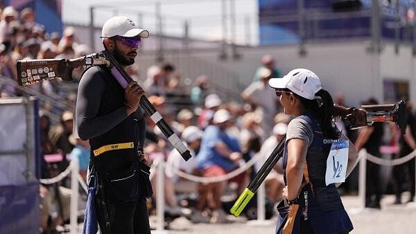 <div class="paragraphs"><p>Paris 2024 Olympics - Shooting - Skeet Mixed Team Bronze Medal - Chateauroux Shooting Centre, Deols, France - August 5, 2024. Maheshwari Chauhan and Anant Jeet Singh Naruka of India during match.</p></div>