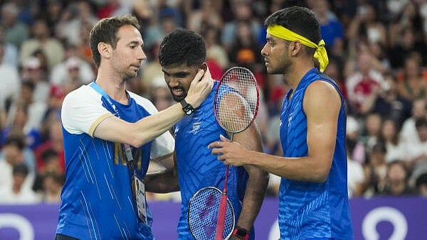 <div class="paragraphs"><p>India's Satwiksairaj Rankireddy and Chirag Shetty with coach Mathias Boe after their men's doubles quarterfinal badminton match against Malaysia's Aaron Chia and Soh Wooi Yik at the 2024 Summer Olympics, in Paris. </p></div>