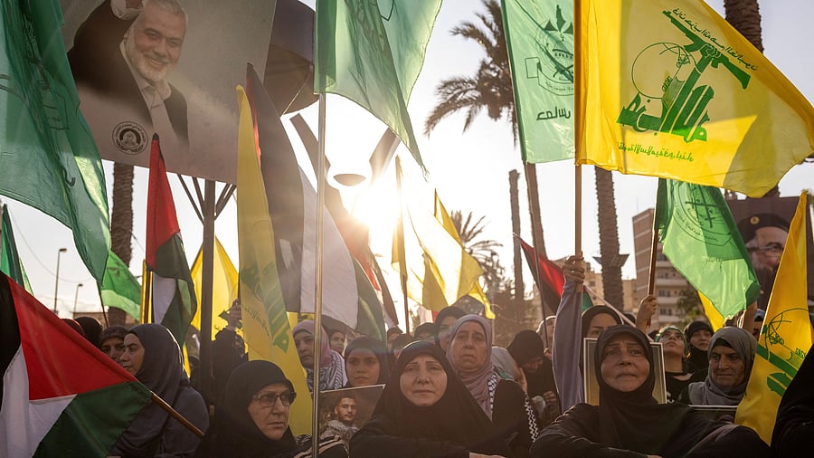 <div class="paragraphs"><p>Supporters of Hamas and Hezbollah take part in a protest condemning the killing of Hamas leader Ismail Haniyeh and Hezbollah top commander Fuad Shukr, in Sidon, Lebanon, August 2, 2024.</p></div>