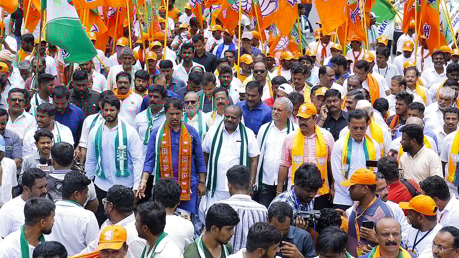 <div class="paragraphs"><p>Ramnagar: Union Minister & JD(S) leader H D Kumaraswamy, his son and party youth leader Nikhil Kumaraswamy with Karnataka BJP Chief B Y Vijayendra, R Ashoka and others take part in Bengaluru-Mysuru padyatra against the alleged MUDA scam and Valmiki Corporation scam, in Ramnagar near Bengaluru, Monday, Aug 5, 2024. </p></div>